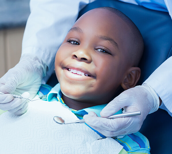 young boy who is about to receive a dental exam