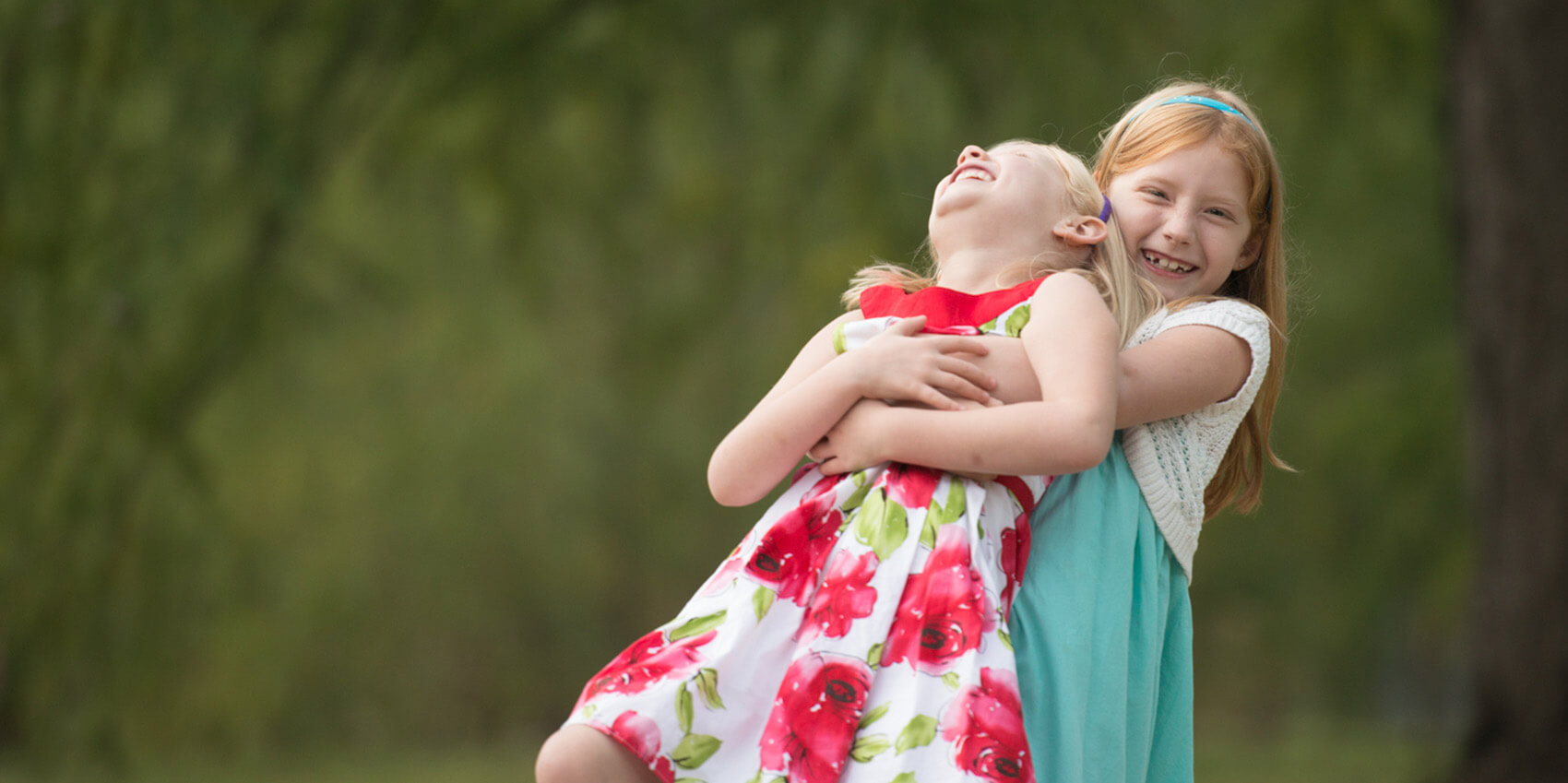 two young sisters hugging