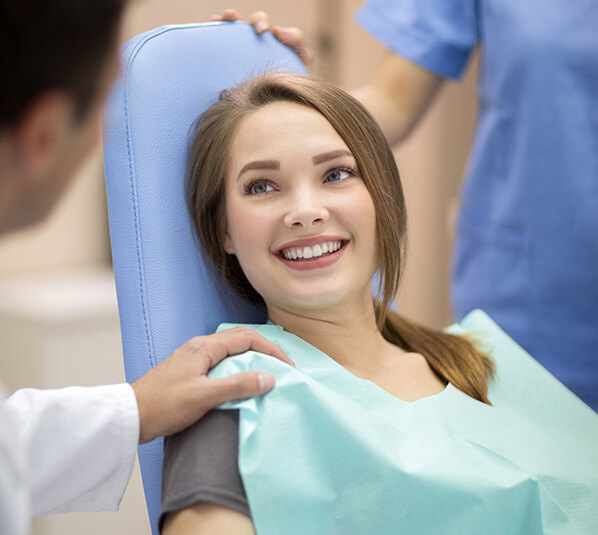 dentist comforting a young patient